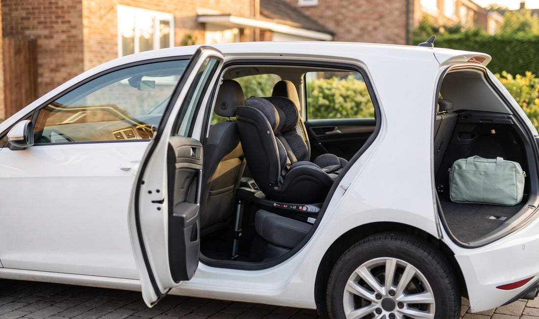 A modern UK family loading a Reecle 360 swivel ISOFIX car seat into a compact hatchback in a sunlit driveway